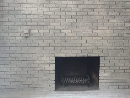 White-washed brick fireplace