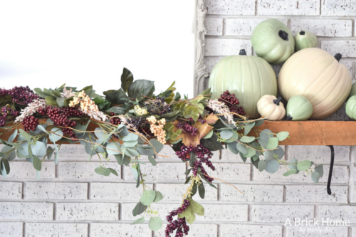 AWESOME Fall Mantel Blog Hop! Did you see this yet? I love the use of dollar store pumpkins and plum decor for the fall mantel! #fallmantel #falldecor #manteldecor