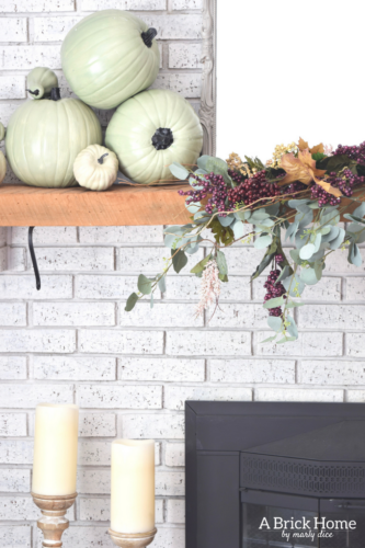 AWESOME Fall Mantel Blog Hop! Did you see this yet? I love the use of dollar store pumpkins and plum decor for the fall mantel! #fallmantel #falldecor #manteldecor