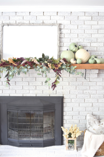 AWESOME Fall Mantel Blog Hop! Did you see this yet? I love the use of dollar store pumpkins and plum decor for the fall mantel! #fallmantel #falldecor #manteldecor