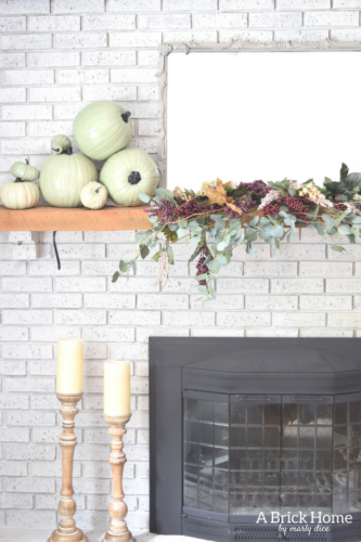 AWESOME Fall Mantel Blog Hop! Did you see this yet? I love the use of dollar store pumpkins and plum decor for the fall mantel! #fallmantel #falldecor #manteldecor