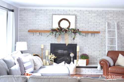 AWESOME Fall Mantel Blog Hop! Did you see this yet? I love the use of dollar store pumpkins and plum decor for the fall mantel! #fallmantel #falldecor #manteldecor