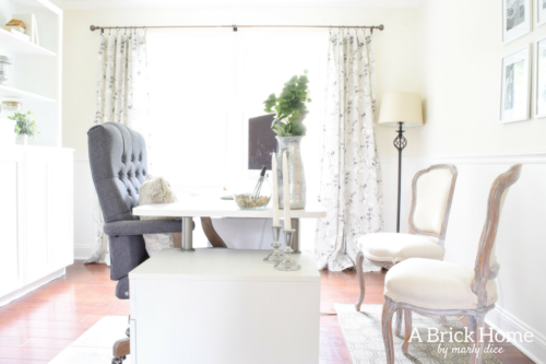 Wow! This feminine home office got a complete makeover! It's beautiful and functional - check out the complete tour. #officedecor #officedesign