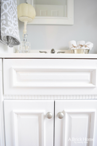This powder room makeover REVEAL is insane! I can't believe how little money she spent to completely transform this powder room to a light and bright one. These small powder room ideas are must-see's!