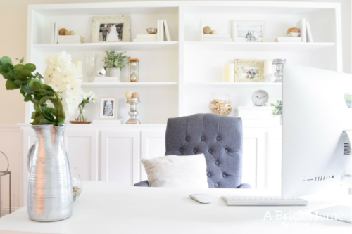 Wow! This feminine home office got a complete makeover! It's beautiful and functional - check out the complete tour. #officedecor #officedesign