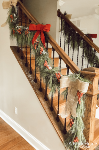 Obsessing over this DIY Christmas Garland! Learn how to make DIY Christmas Garland Using Simple Faux Garland and Real Pine Branches! #abrickhome #garland
