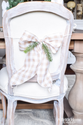 Gorgeous Dining Room Decked out in Transitional Fall to Winter Holiday Decor! A snowy tablescape with evergreens and pumpkins top off the almost Christmas decor look! #falldecor #winterdecor