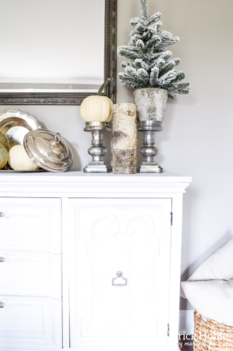 Gorgeous Dining Room Decked out in Transitional Fall to Winter Holiday Decor! A snowy tablescape with evergreens and pumpkins top off the almost Christmas decor look! #falldecor #winterdecor