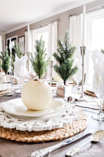 Gorgeous Dining Room Decked out in Transitional Fall to Winter Holiday Decor! A snowy tablescape with evergreens and pumpkins top off the almost Christmas decor look! #falldecor #winterdecor
