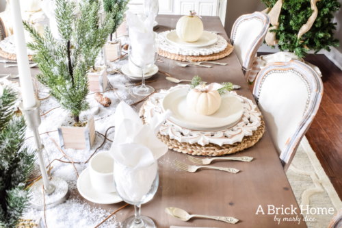 Gorgeous Dining Room Decked out in Transitional Fall to Winter Holiday Decor! A snowy tablescape with evergreens and pumpkins top off the almost Christmas decor look! #falldecor #winterdecor
