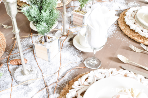 Gorgeous Dining Room Decked out in Transitional Fall to Winter Holiday Decor! A snowy tablescape with evergreens and pumpkins top off the almost Christmas decor look! #falldecor #winterdecor