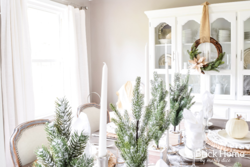 Gorgeous Dining Room Decked out in Transitional Fall to Winter Holiday Decor! A snowy tablescape with evergreens and pumpkins top off the almost Christmas decor look! #falldecor #winterdecor