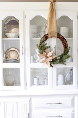 Gorgeous Dining Room Decked out in Transitional Fall to Winter Holiday Decor! A snowy tablescape with evergreens and pumpkins top off the almost Christmas decor look! #falldecor #winterdecor