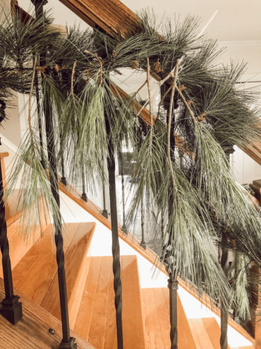 Obsessing over this DIY Christmas Garland! Learn how to make DIY Christmas Garland Using Simple Faux Garland and Real Pine Branches! #abrickhome #garland
