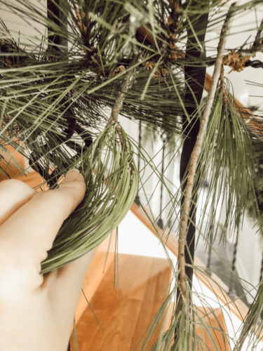 Obsessing over this DIY Christmas Garland! Learn how to make DIY Christmas Garland Using Simple Faux Garland and Real Pine Branches! #abrickhome #garland