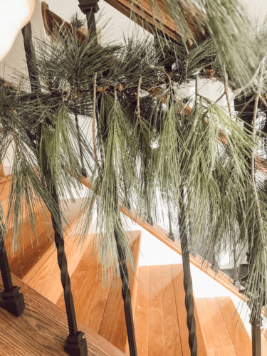 Obsessing over this DIY Christmas Garland! Learn how to make DIY Christmas Garland Using Simple Faux Garland and Real Pine Branches! #abrickhome #garland