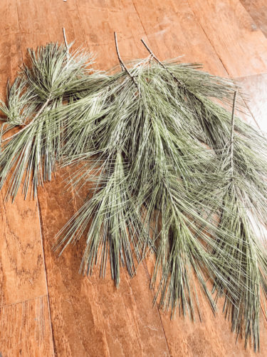 Obsessing over this DIY Christmas Garland! Learn how to make DIY Christmas Garland Using Simple Faux Garland and Real Pine Branches! #abrickhome #garland