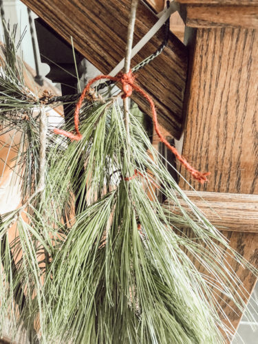 Obsessing over this DIY Christmas Garland! Learn how to make DIY Christmas Garland Using Simple Faux Garland and Real Pine Branches! #abrickhome #garland