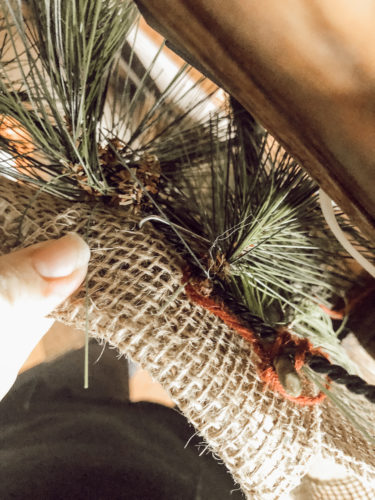 Obsessing over this DIY Christmas Garland! Learn how to make DIY Christmas Garland Using Simple Faux Garland and Real Pine Branches! #abrickhome #garland