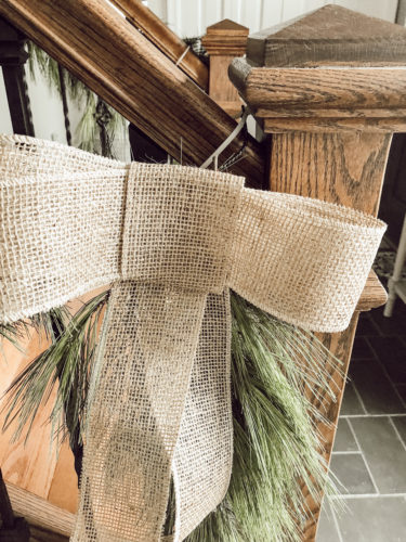 Obsessing over this DIY Christmas Garland! Learn how to make DIY Christmas Garland Using Simple Faux Garland and Real Pine Branches! #abrickhome #garland