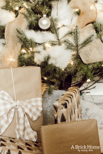 This Snowy white Christmas tree is both rustic and elegant. I CAN'T BELIEVE what she used for the snow on the tree! #christmastreedecor