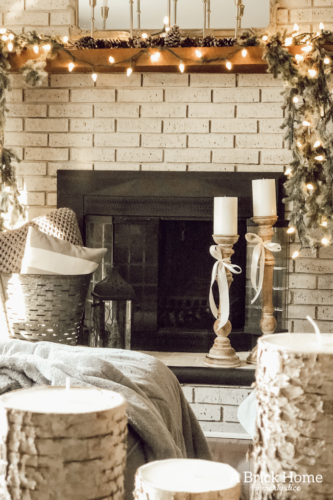 This gorgeous neutral Christmas mantel accompanies a cozy and neutral family room with a snow-filled Christmas tree! Take the whole tour NOW! Tons of inspiration!! #christmasmantel