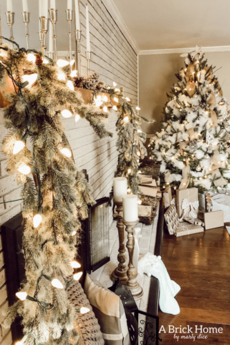 This gorgeous neutral Christmas mantel accompanies a cozy and neutral family room with a snow-filled Christmas tree! Take the whole tour NOW! Tons of inspiration!! #christmasmantel