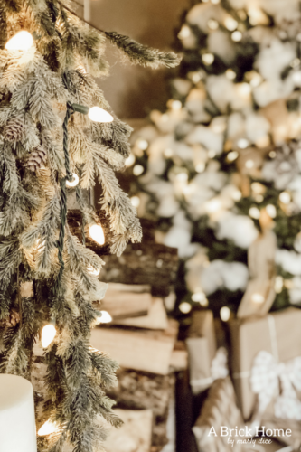 This gorgeous neutral Christmas mantel accompanies a cozy and neutral family room with a snow-filled Christmas tree! Take the whole tour NOW! Tons of inspiration!! #christmasmantel