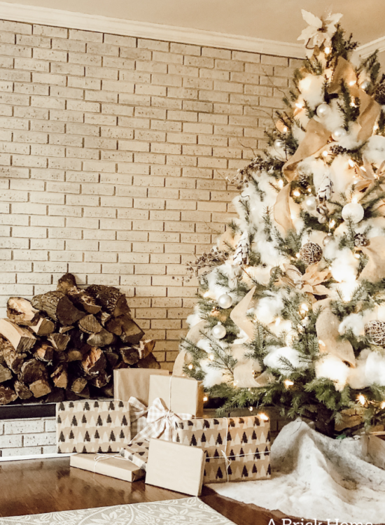 This Snowy white Christmas tree is both rustic and elegant. I CAN'T BELIEVE what she used for the snow on the tree! #christmastreedecor