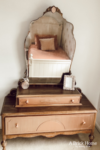 Such a sweet rose gold dresser makeover for a little girl. Gorgeous antique vanity dresser! #dressermakeover