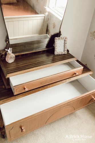 Such a sweet rose gold dresser makeover for a little girl. Gorgeous antique vanity dresser! #dressermakeover