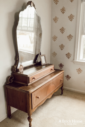 Such a sweet rose gold dresser makeover for a little girl. Gorgeous antique vanity dresser! #dressermakeover