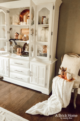 LOVING these COPPER decor accents right now. Perfect for winter and paired with wood tones. See how Marly decorates her dining room with copper. #copperdecor