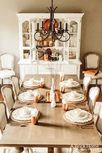 LOVING these COPPER decor accents right now. Perfect for winter and paired with wood tones. See how Marly decorates her dining room with copper. #copperdecor