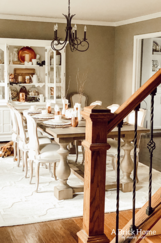 LOVING these COPPER decor accents right now. Perfect for winter and paired with wood tones. See how Marly decorates her dining room with copper. #copperdecor