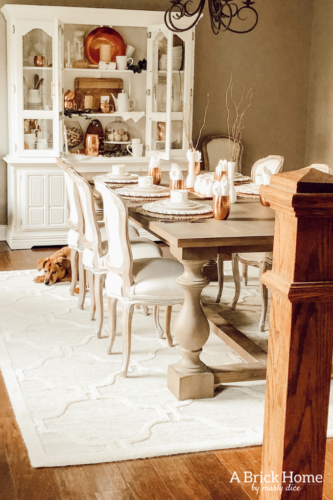 LOVING these COPPER decor accents right now. Perfect for winter and paired with wood tones. See how Marly decorates her dining room with copper. #copperdecor