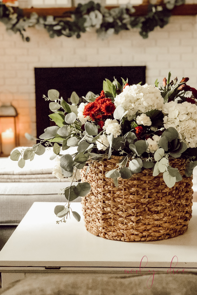 Learn how to make this fall flower arrangement in a basket using hydrangeas and eucalyptus! #fallflowerarrangment #basketofflowers #fallflowers