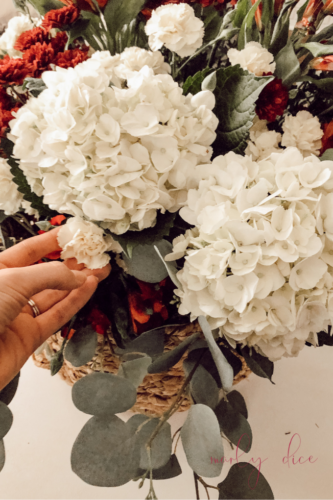 Learn how to make a fall flower arrangement in a basket using hydrangeas and eucalyptus! #fallflowerarrangment #basketofflowers #fallflowers