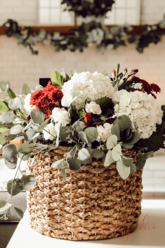 Learn how to make this fall flower arrangement in a basket using hydrangeas and eucalyptus! #fallflowerarrangment #basketofflowers #fallflowers