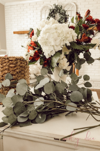 Learn how to make a fall flower arrangement in a basket using hydrangeas and eucalyptus! #fallflowerarrangment #basketofflowers #fallflowers