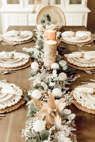 Loving this rustic winter tablescape and winter dining room decor! Beautiful use of eucalyptus and burlap together. #rusticwintertablescape #winterdecor #winterdiningroomdecor