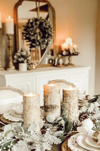 Loving this rustic winter tablescape and winter dining room decor! Beautiful use of eucalyptus and burlap together. #rusticwintertablescape #winterdecor #winterdiningroomdecor