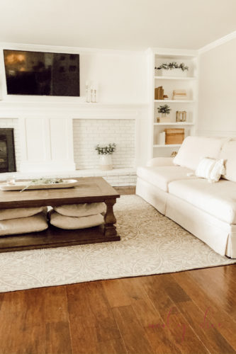 See how they fixed an off center fireplace in this gorgeous DIY fireplace makeover! #diyfireplacemakeover #offcenterfireplace #diyfireplacemantel