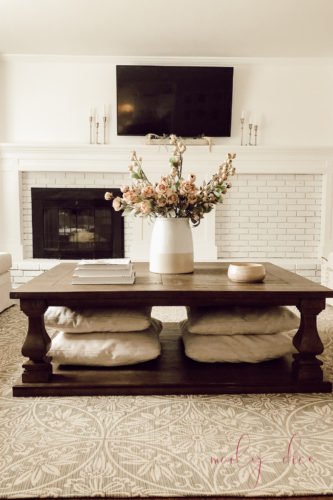 See how they fixed an off center fireplace in this gorgeous DIY fireplace makeover! #diyfireplacemakeover #offcenterfireplace #diyfireplacemantel
