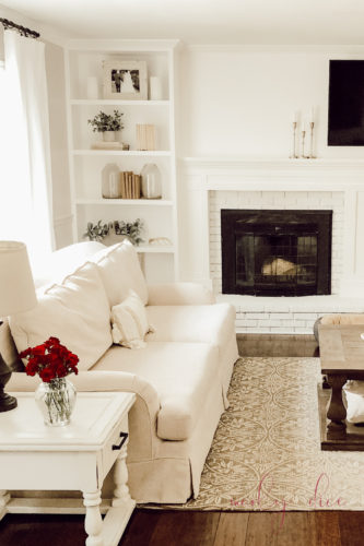See how they fixed an off center fireplace in this gorgeous DIY fireplace makeover! #diyfireplacemakeover #offcenterfireplace #diyfireplacemantel