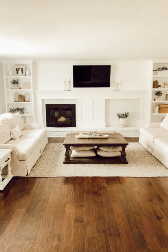 See how they fixed an off center fireplace in this gorgeous DIY fireplace makeover! #diyfireplacemakeover #offcenterfireplace #diyfireplacemantel