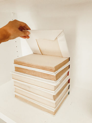 The no-fail way to style a bookshelf that anyone can do using old books. Learn how to get this sophisticated look that'll go well with any decor style! #styleabookshelf