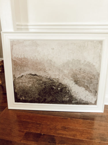 This textured DIY wall art is so easy to do!! See how she made texture over top an old painting and completely revamped it! #diywallart #diypainting