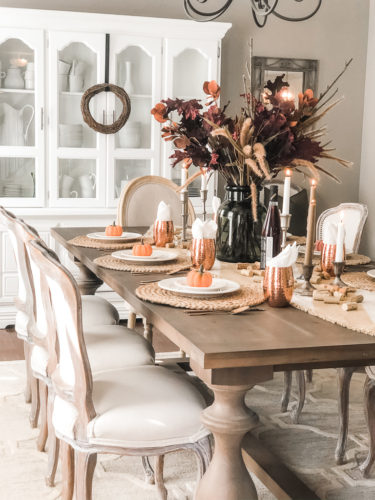 Obsessing over these gorgeous fall stems and moody fall decor on this tables cape! #falldecor #moodyfalldecor #falltablescape