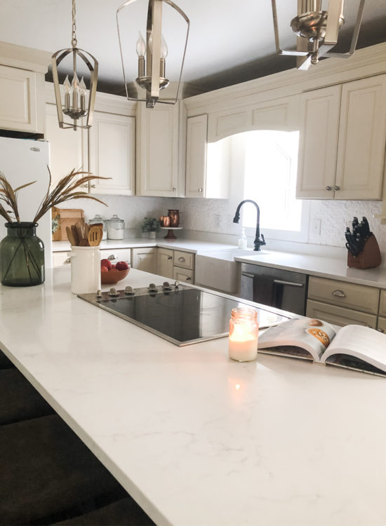 We swapped our granite for these gorgeous white quartz countertops and we LOVE them! #quartzcountertops